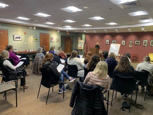 An audience seated for Jill Sylvester’s library program in Hanover